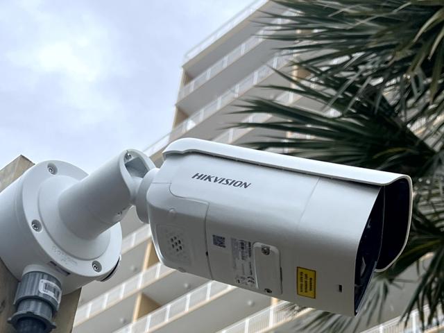 Urban surveillance setup on a high-rise building ensuring public safety and smart monitoring.